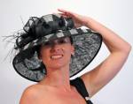 Fun and fashionable checked black and grey hat with feathers